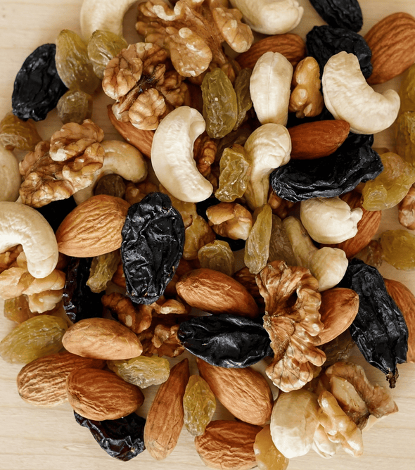 Superfarmers Unsalted Mixed Nuts 500g resealable pouch featuring a visible mix of walnuts, almonds, cashews, and black and green raisins.